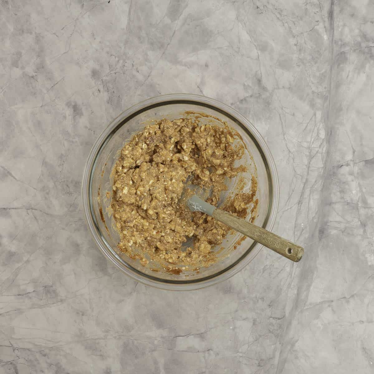Cottage cheese, salsa and taco seasoning combined together in a glass mixing bowl. 