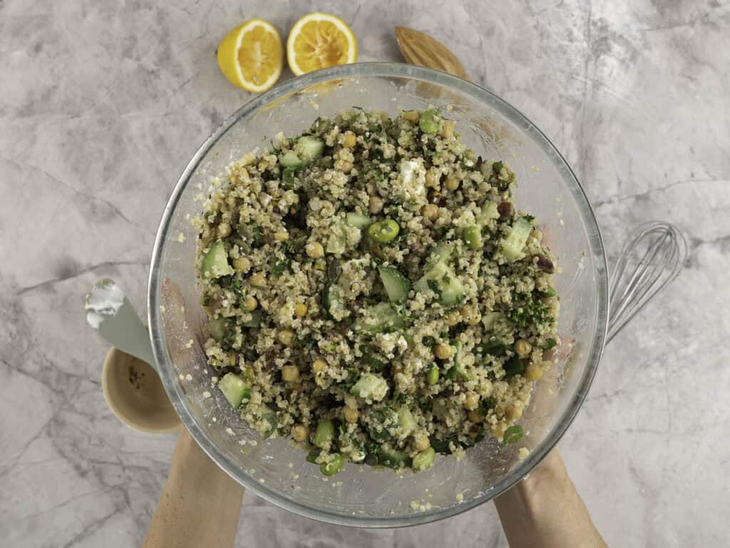 Large glass bowl with salad inside.