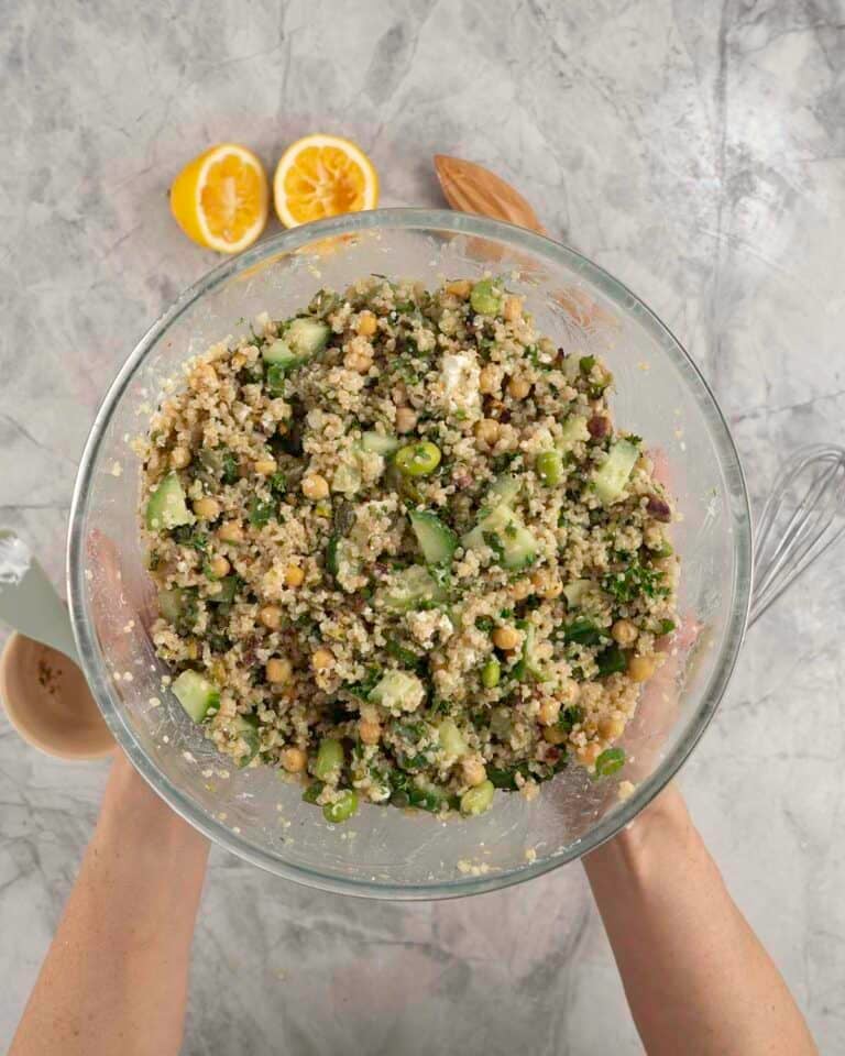 Large glass bowl with quinoa salad inside.
