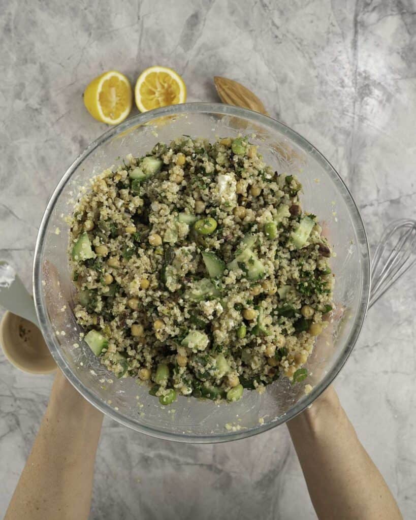 Large glass bowl with quinoa salad inside.