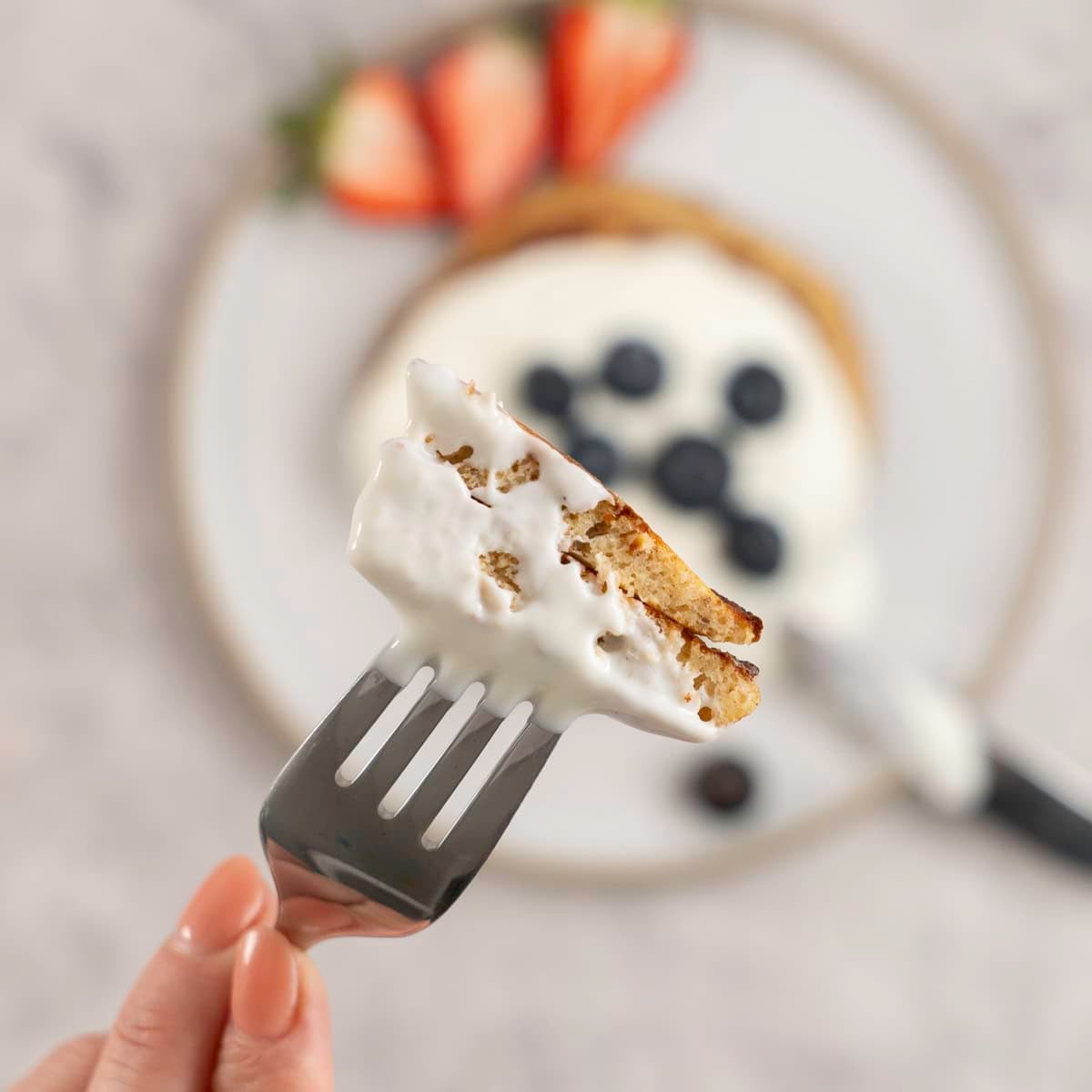 Fork with a piece of pancake on it.